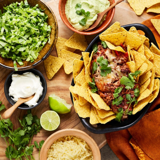 Mexican Beef Nachos with Beans, Guacamole and Sour Cream