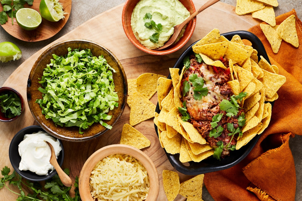 Mexican Beef Nachos with Beans, Guacamole and Sour Cream